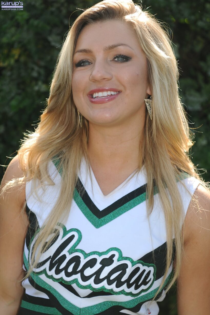 Image 1/20: Embry Prada strips down and poses in the backyard as a blonde cheerleader