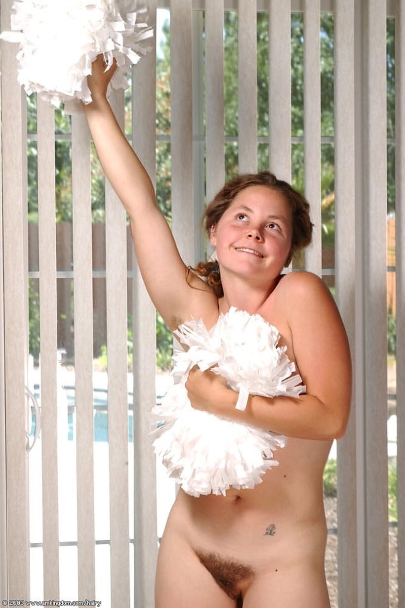 Redhead cheerleader slips her underwear down to finger her bush outdoors, photo 13 of 21