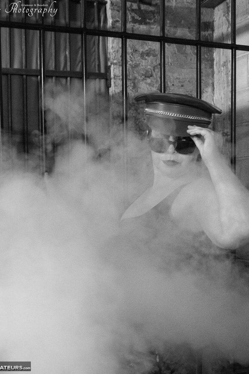 Posh Sophia poses in fetish outfits inside and outside a jail cell, photo 2 of 16