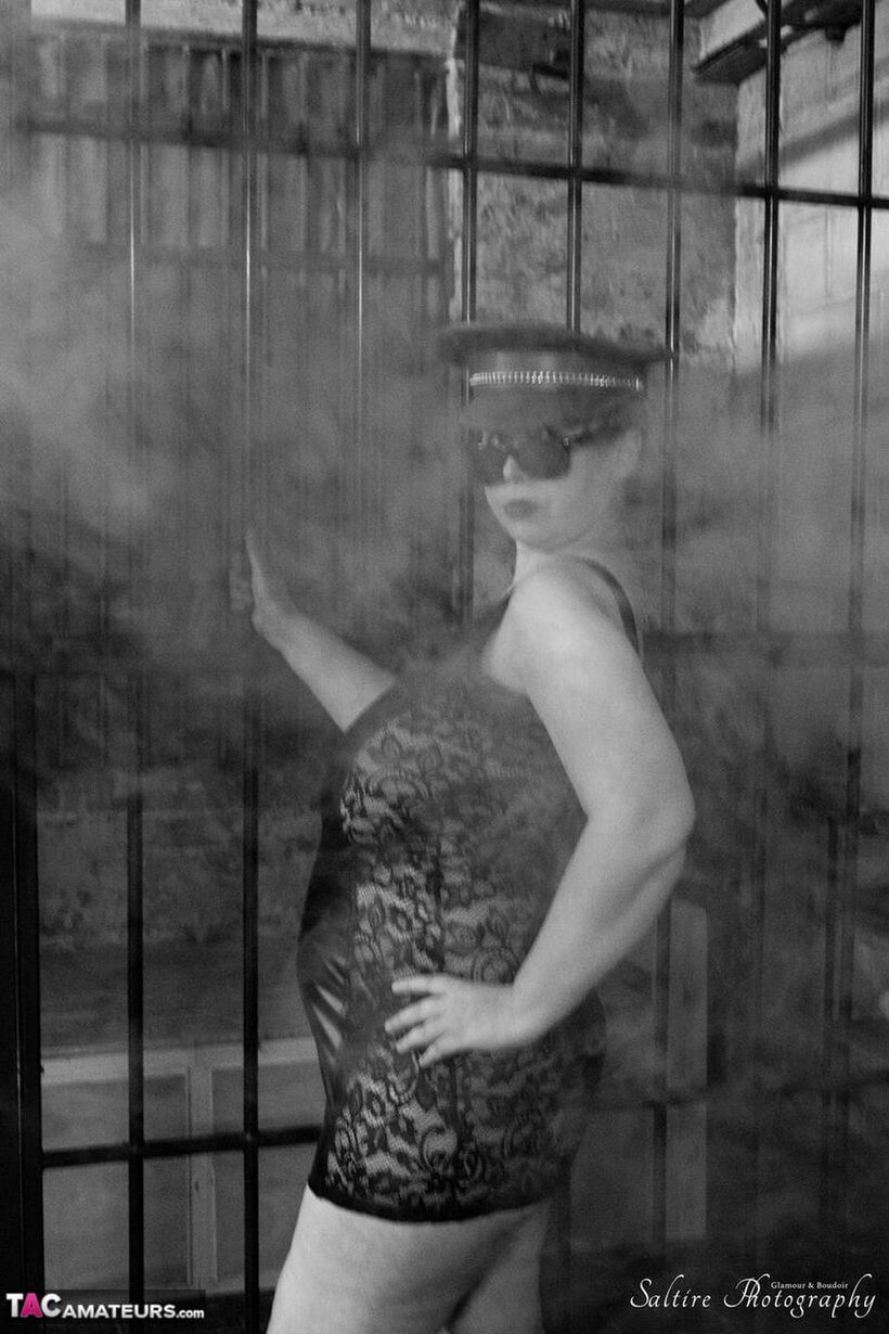 Posh Sophia pic 3 from the set «Posh Sophia poses in fetish outfits inside and outside a jail cell»