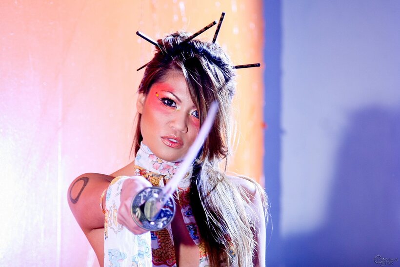 Photo 6 — Charmane Star strips to heels while posing with a sword