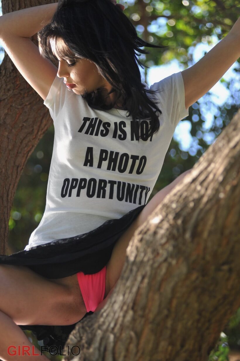 Jessi Palmer flashes her thong upskirt beside a tree (shot 11)