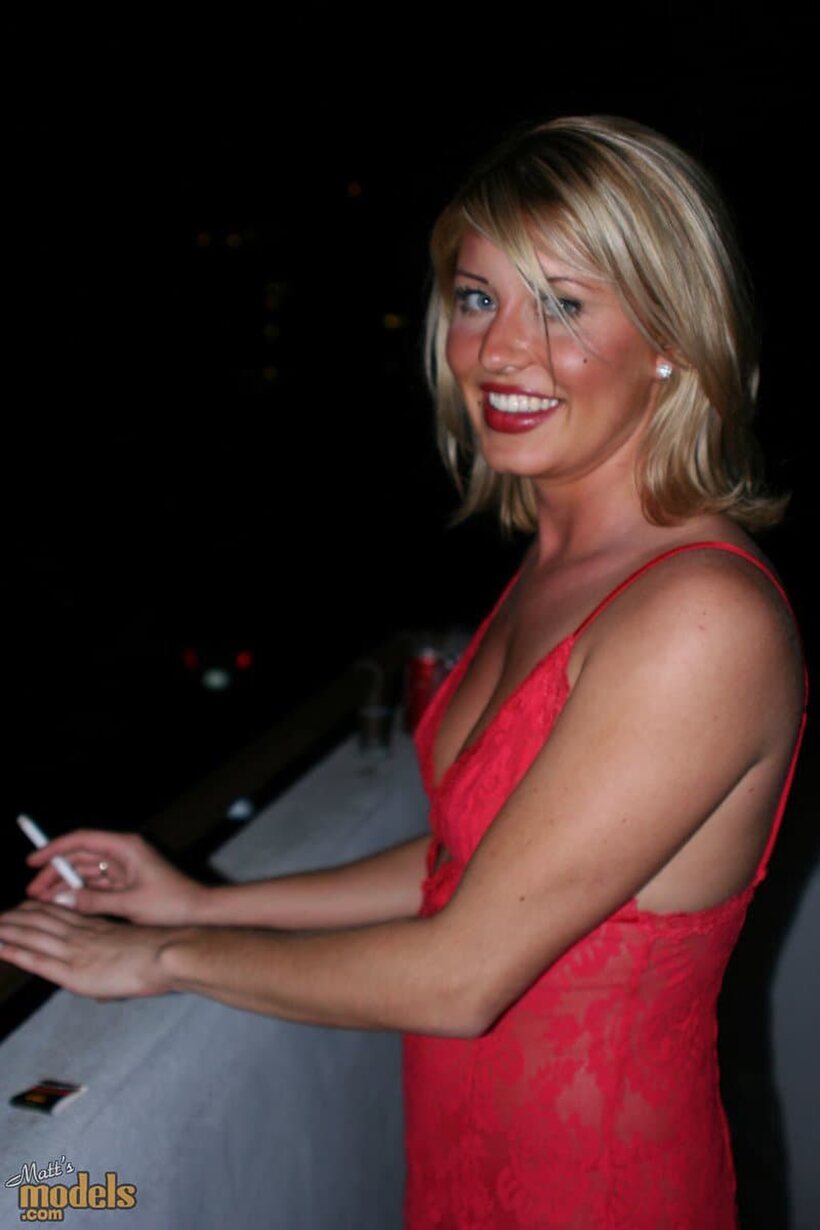 Lingerie-clad blonde with firm tits smokes naked on the balcony (shot 9)
