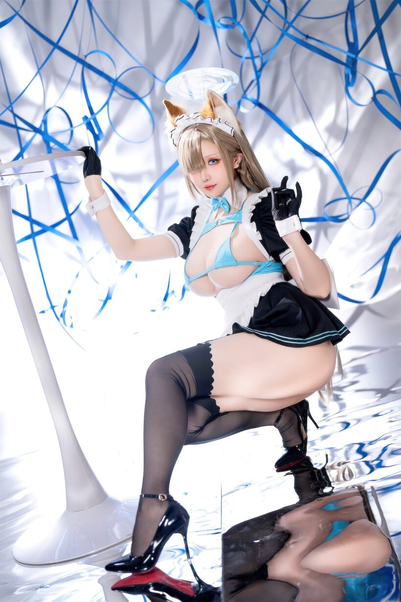 Image 3/10: Stockings and a maid outfit show off her big ass and tits