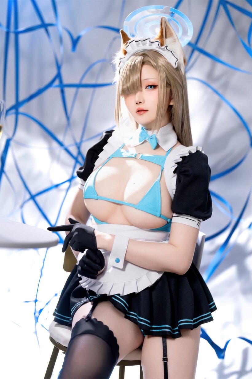 Photo 6 — Stockings and a maid outfit show off her big ass and tits