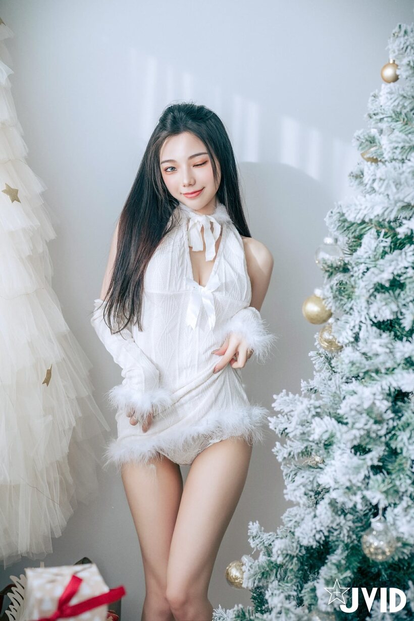 Asian nude photo 4 — Pink pussy on display as a solo girl stretches her long legs by the tree
