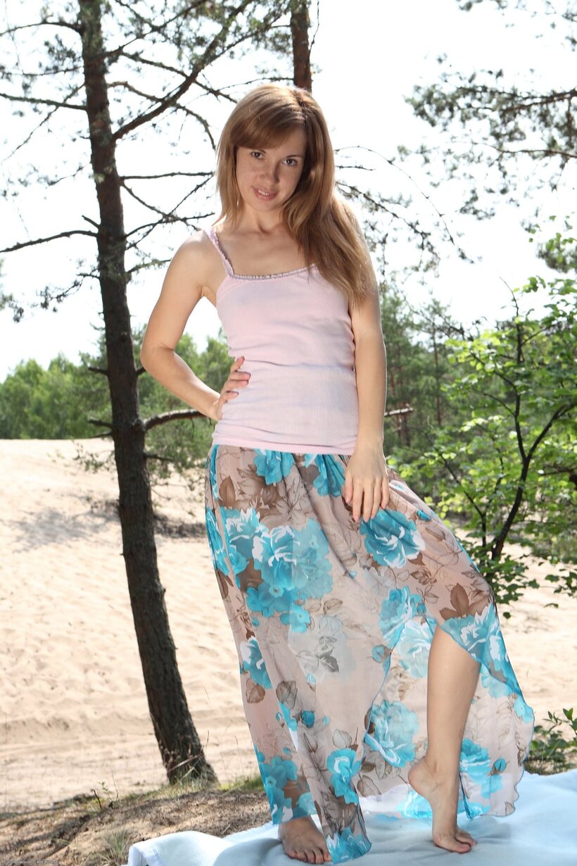 Naked redhead poses on a blanket in the forest, pussy exposed, photo 1 of 21