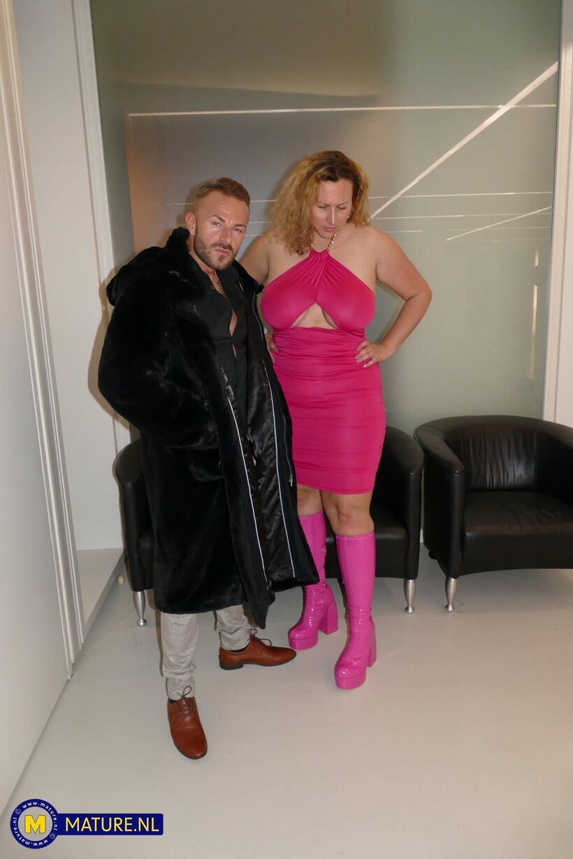 Chubby Kathy Deep poses with her big tits on display in a skirt (shot 1)