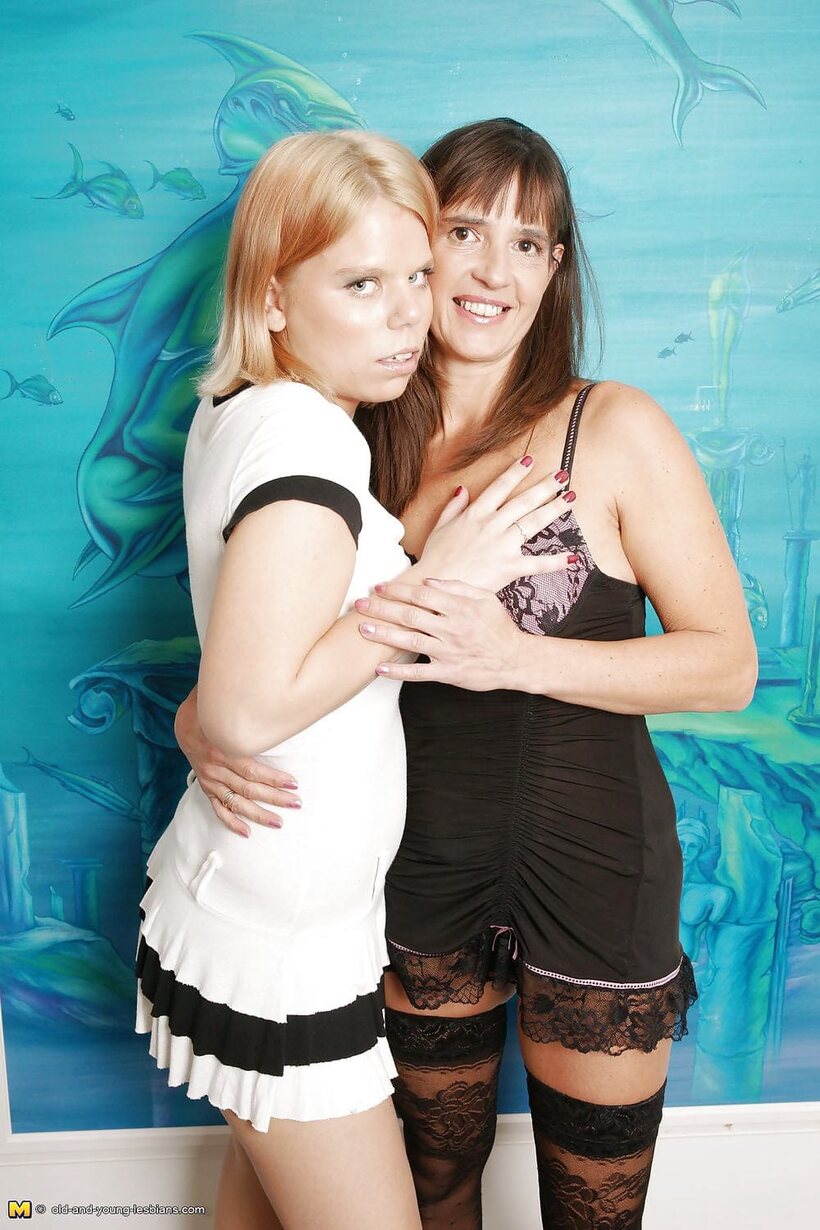 Photo 1 — Amateur girl shows her small tits while playing with a girlfriend