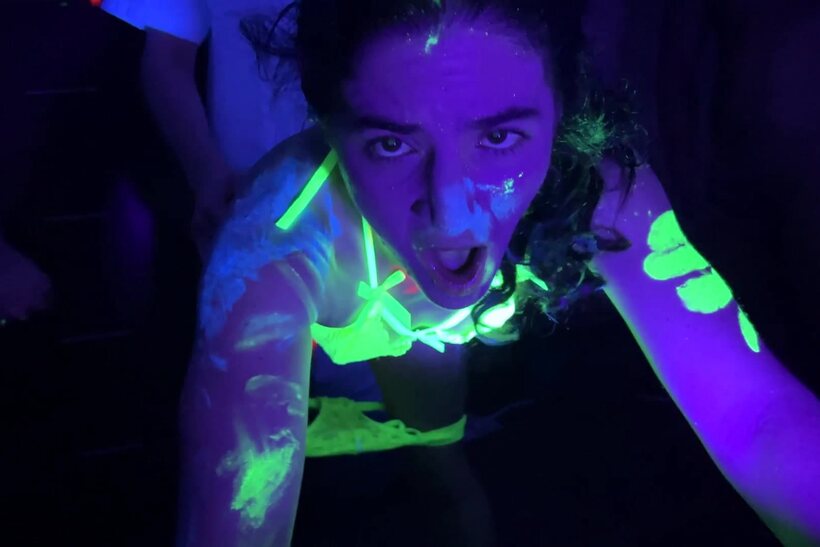 Vanessa Cliff takes part in a glow-lit gangbang party (shot 4)