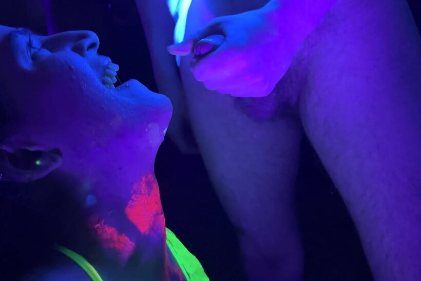 Photo 19 — Vanessa Cliff takes part in a glow-lit gangbang party