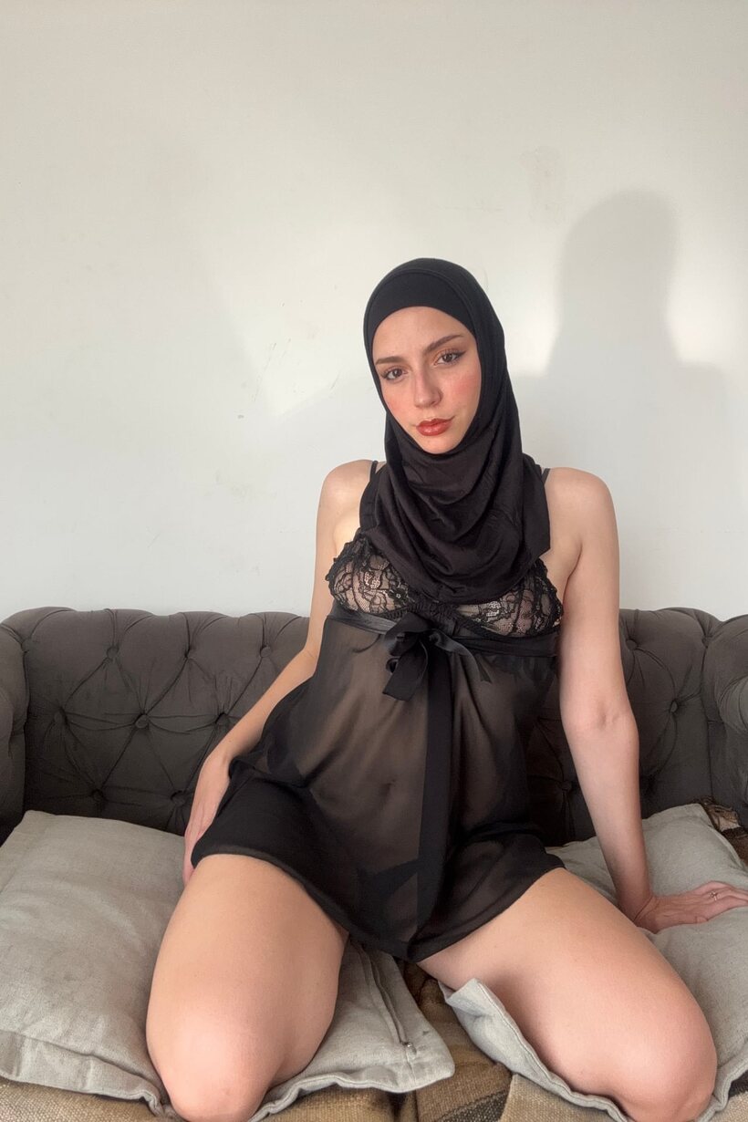 In sheer lingerie, a curvy Arab model poses wearing a black hijab (shot 7)
