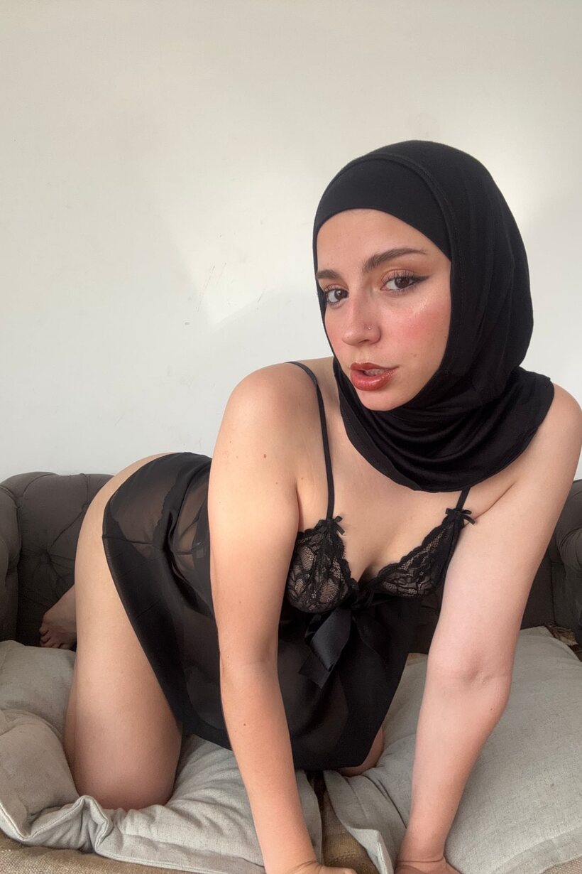 Amateur nude photo 11 — In sheer lingerie, a curvy Arab model poses wearing a black hijab