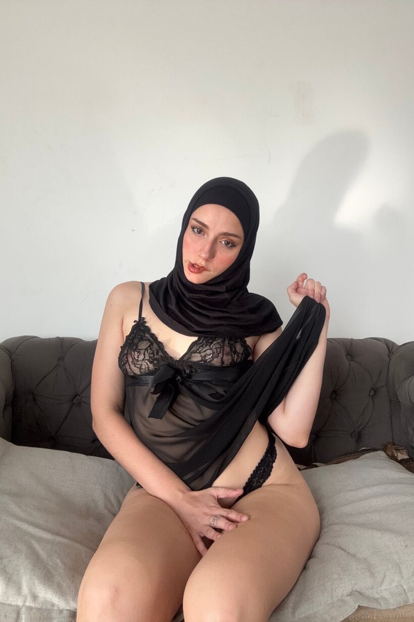 Amateur nude photo 13 — In sheer lingerie, a curvy Arab model poses wearing a black hijab
