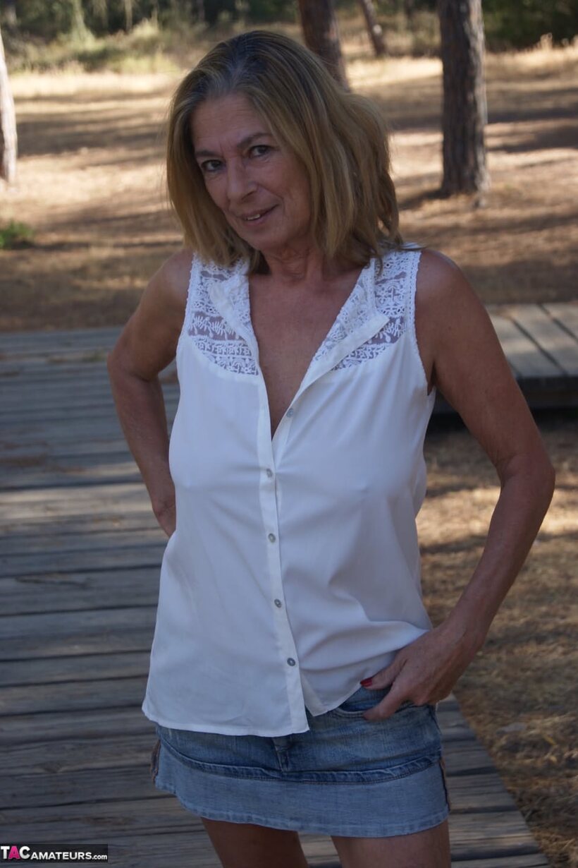 Marta Style pic 2 from the set «Marta Style slips out of her skirt and bares her saggy tits outdoors»