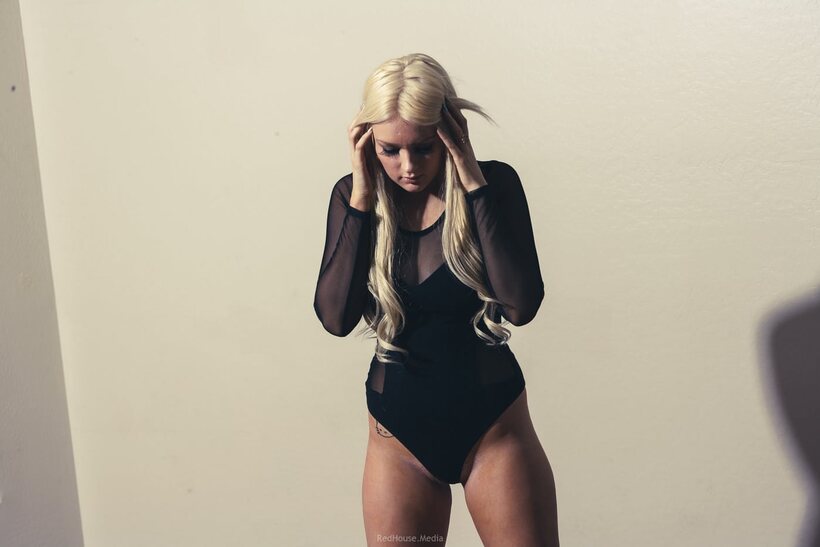 Blonde model teases in a bodysuit and heels, showing her big ass, photo 6 of 21
