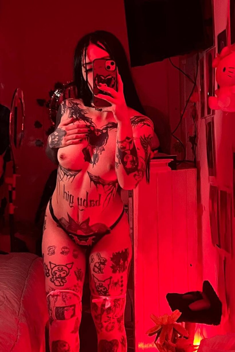 Amateur nude photo 16 — Tattooed teen poses for selfies with her tits out in a thong