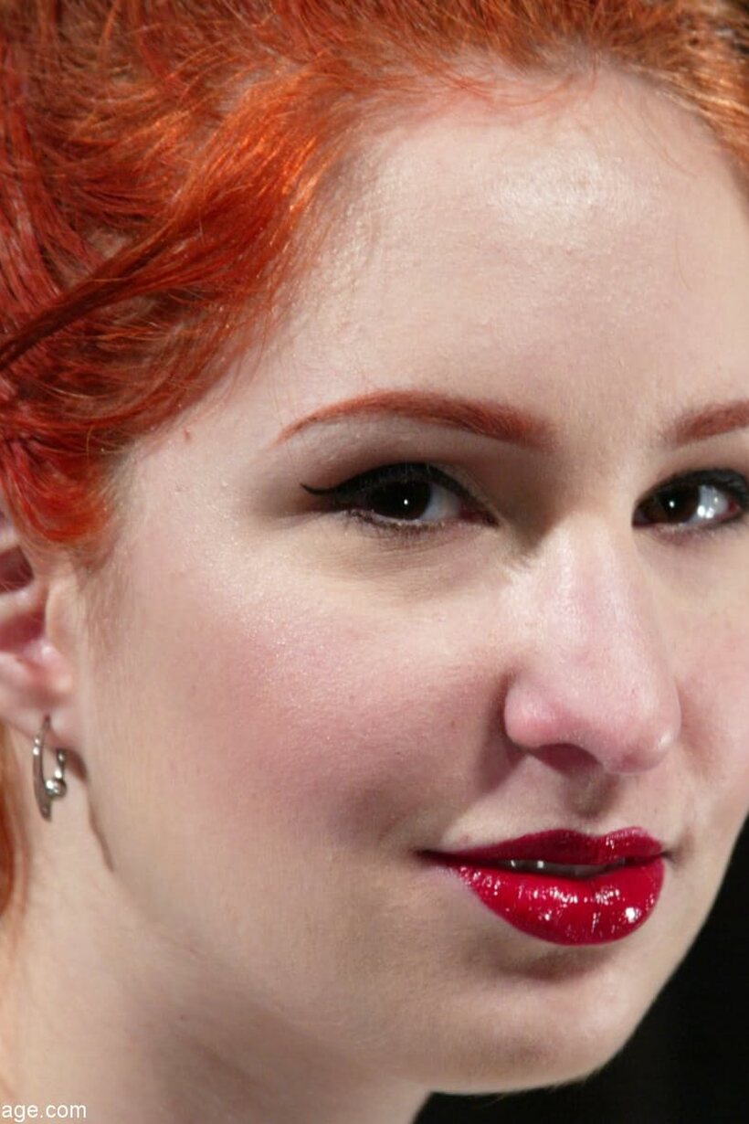 In the dungeon, a pale redhead is tied up and pleasured (shot 2)