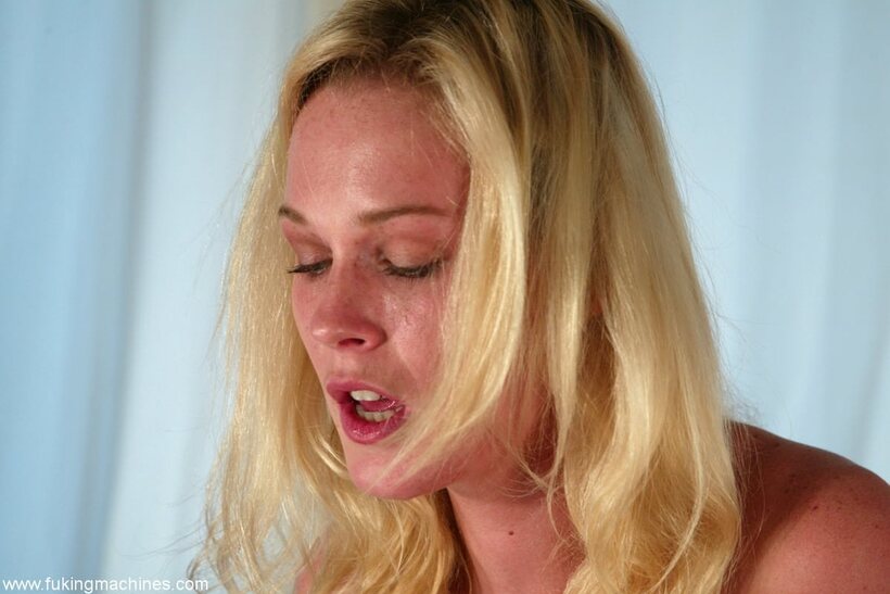 Photo 13 — Blonde mom Phoenix grinds a rubber toy on the sybian for pleasure