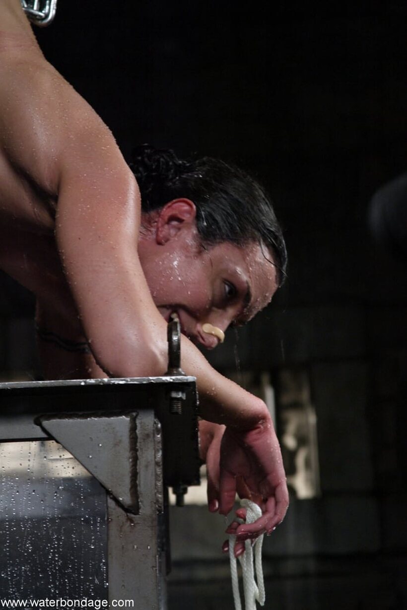 Bound and submerged, Wenona is held under in her master’s tank, photo 8 of 20
