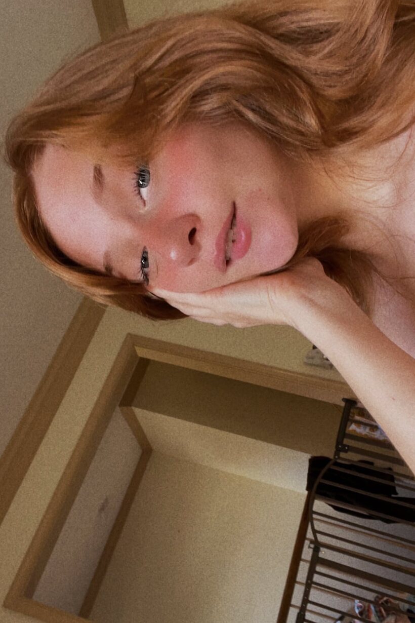 Redhead snaps selfies while slipping into a crotchless dress (shot 6)