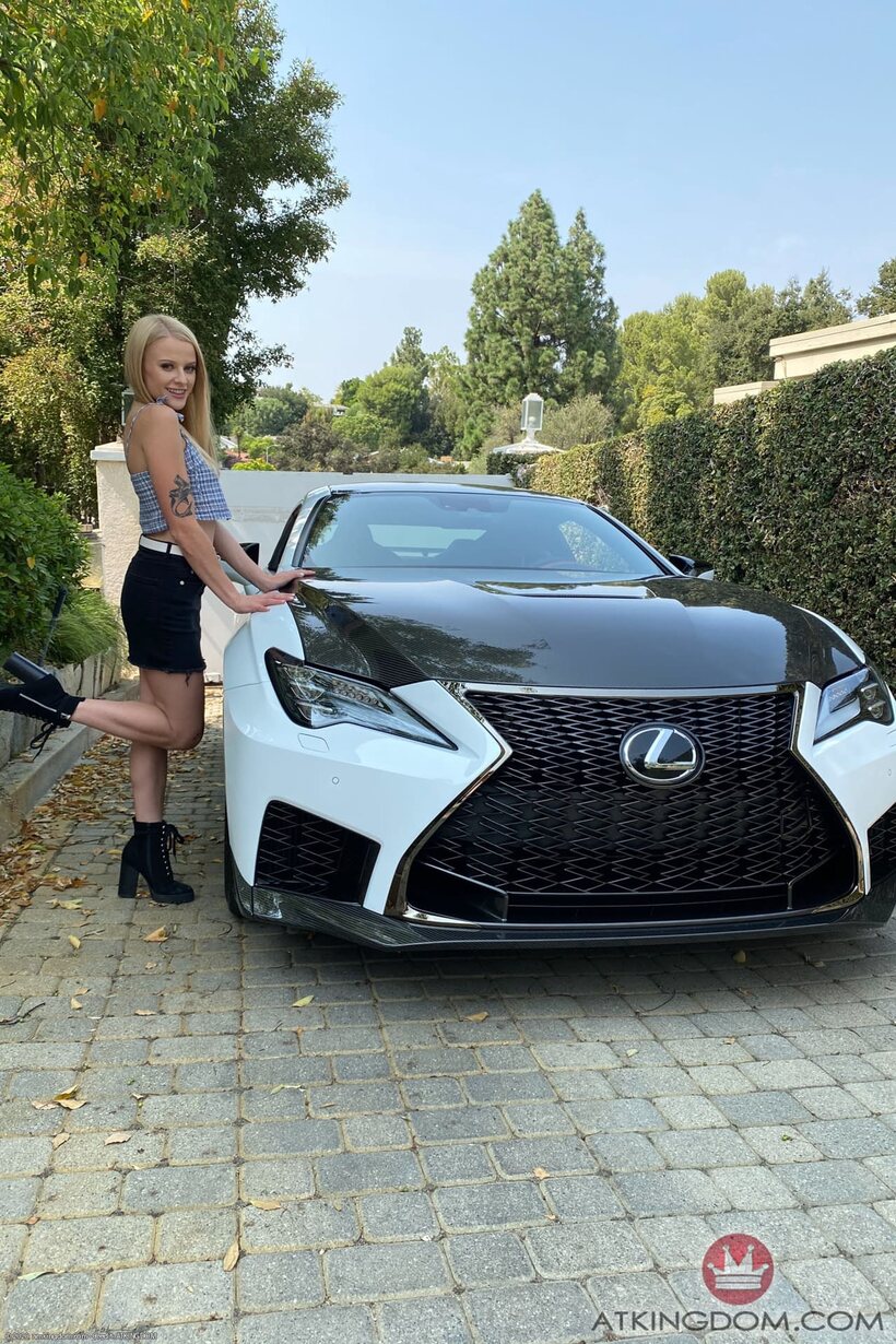 Photo 2 — Paris White spreads her legs and squeezes her tits on a Lexus