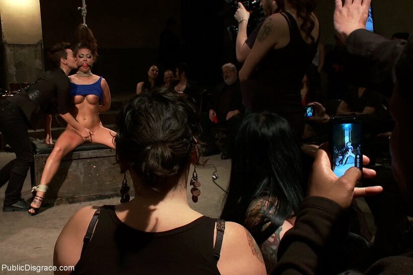 Jiz Lee and Melissa Jacobs fuck a sex slave onstage in public (shot 18)