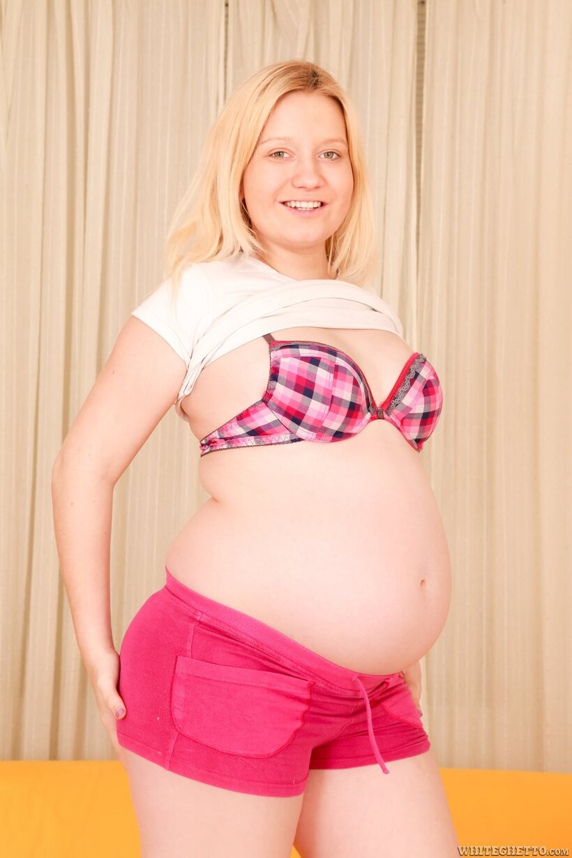 Photo 2 — Jessica Lion bares her pregnant belly and hairy pussy before hardcore sex