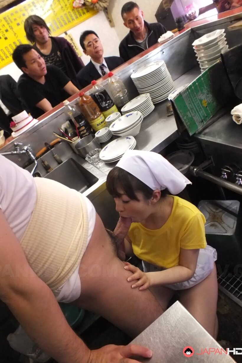 Photo 2 — Mimi Asuka takes turns with chefs in the restaurant kitchen
