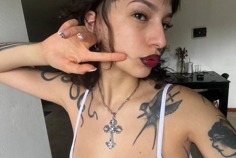 Image 8/20: Miss Yazminn flashes her inked curves in a solo nude show
