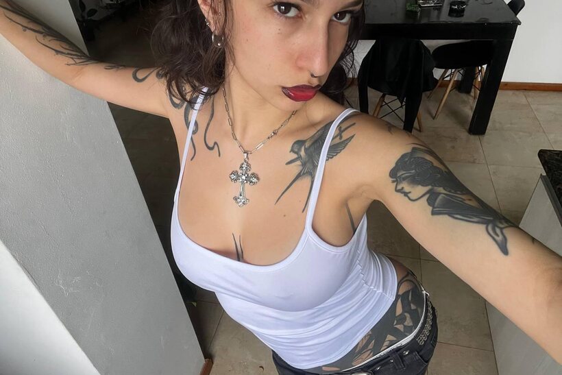 Image 9/20: Miss Yazminn flashes her inked curves in a solo nude show