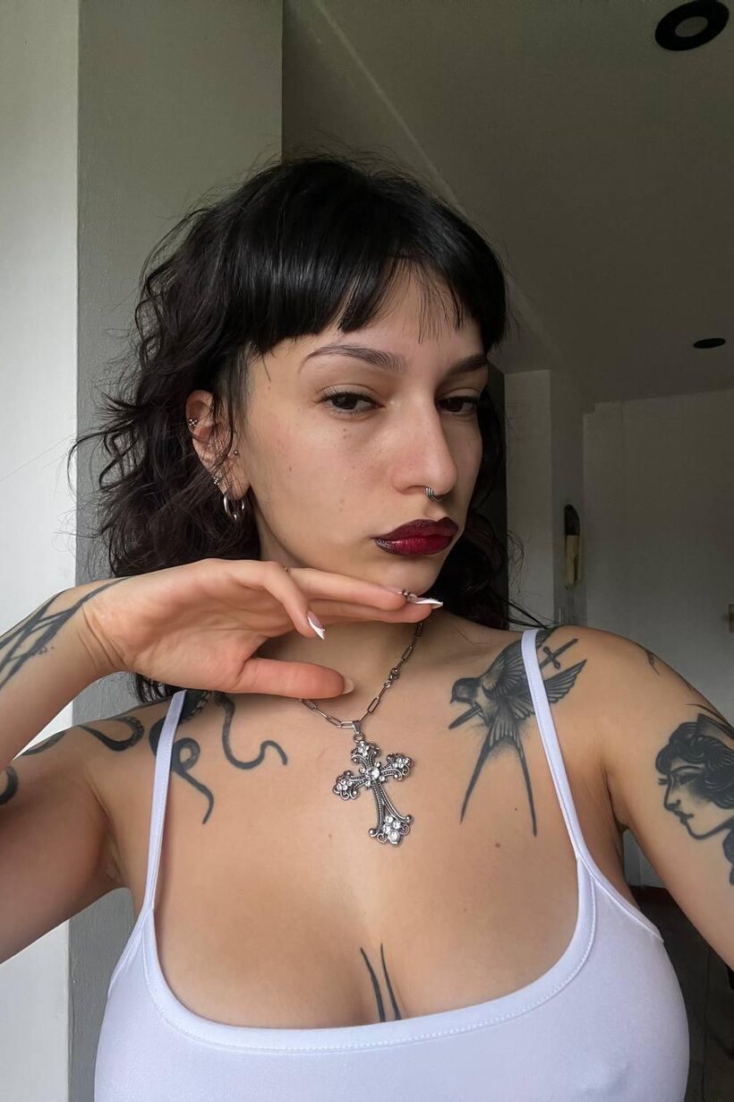 Image 11/20: Miss Yazminn flashes her inked curves in a solo nude show