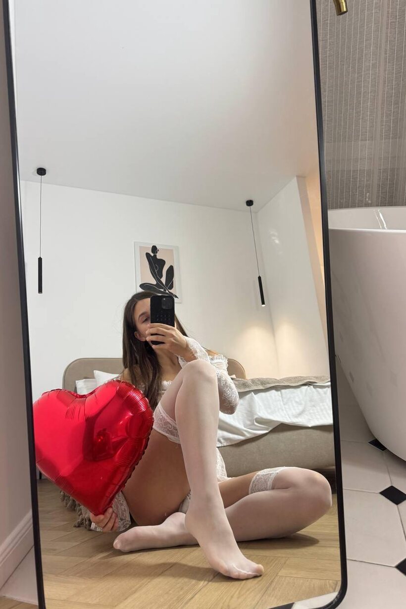 Image 8/10: MILF poses with her feet on display in stockings