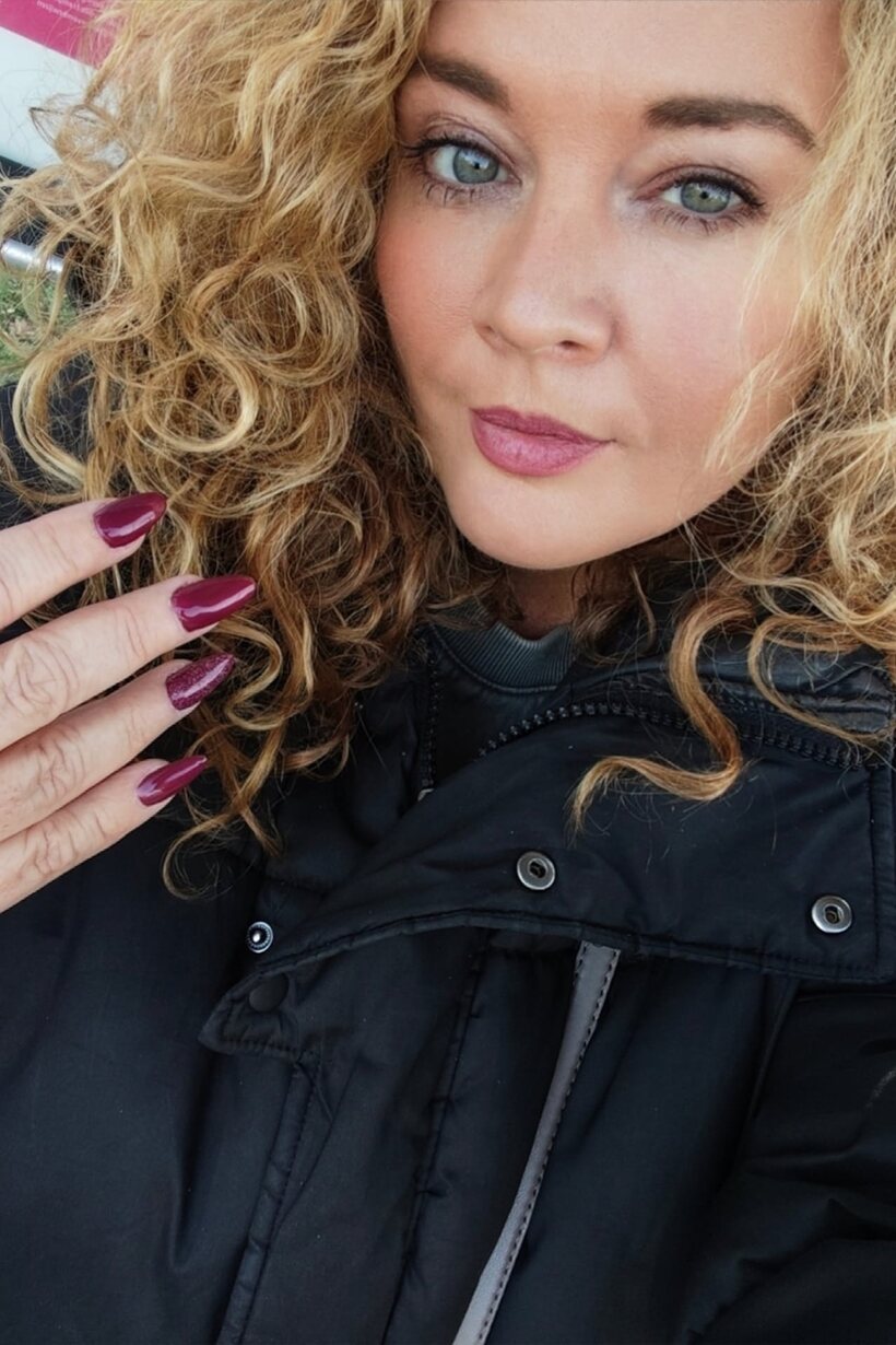 Photo 7 — Curly-haired bbw shows off her big breasts in non-nude shots
