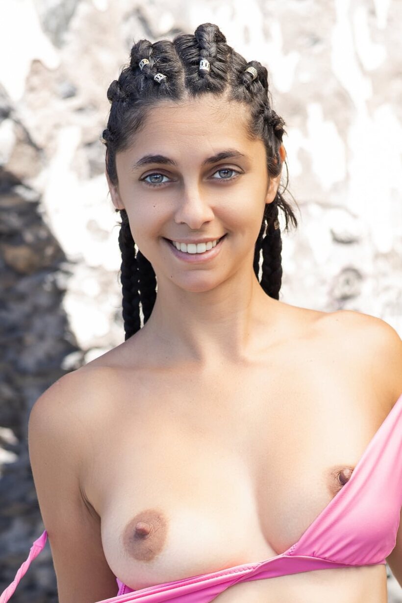 Babe nude photo 21 — Long braids frame a teen babe stripping fully nude for the camera