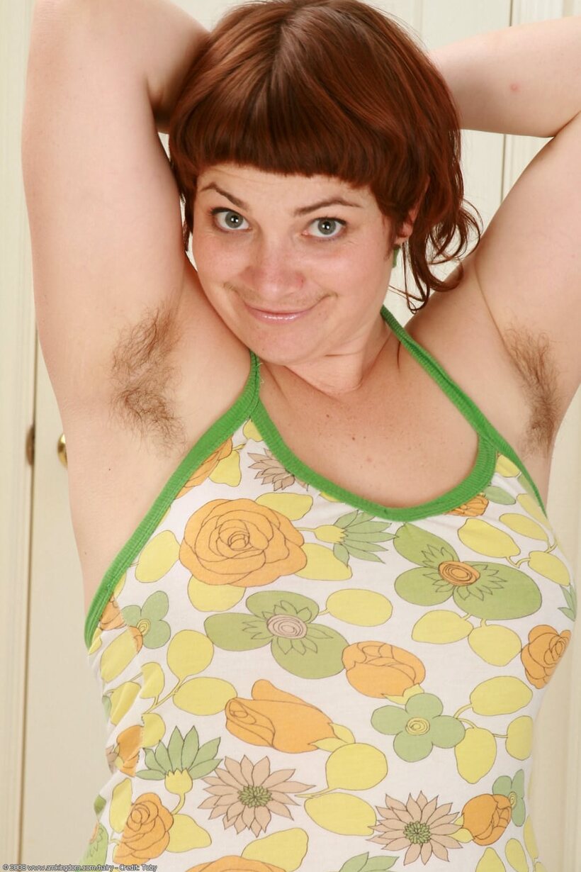 Image 1/21: Mitzy flashes hairy armpits, then opens her beaver wide