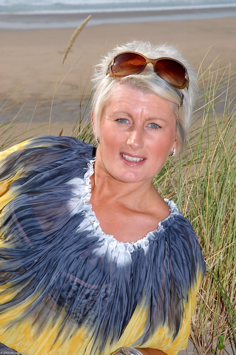 Sally T shows her pierced pussy and tiny nipples in a beach dress, photo 2 of 20
