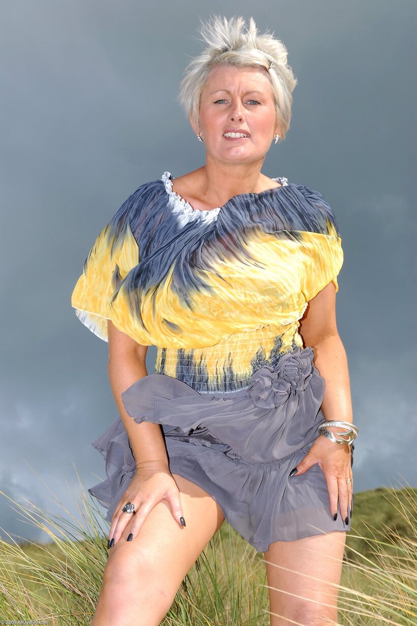 BBW nude photo 7 — Sally T shows her pierced pussy and tiny nipples in a beach dress