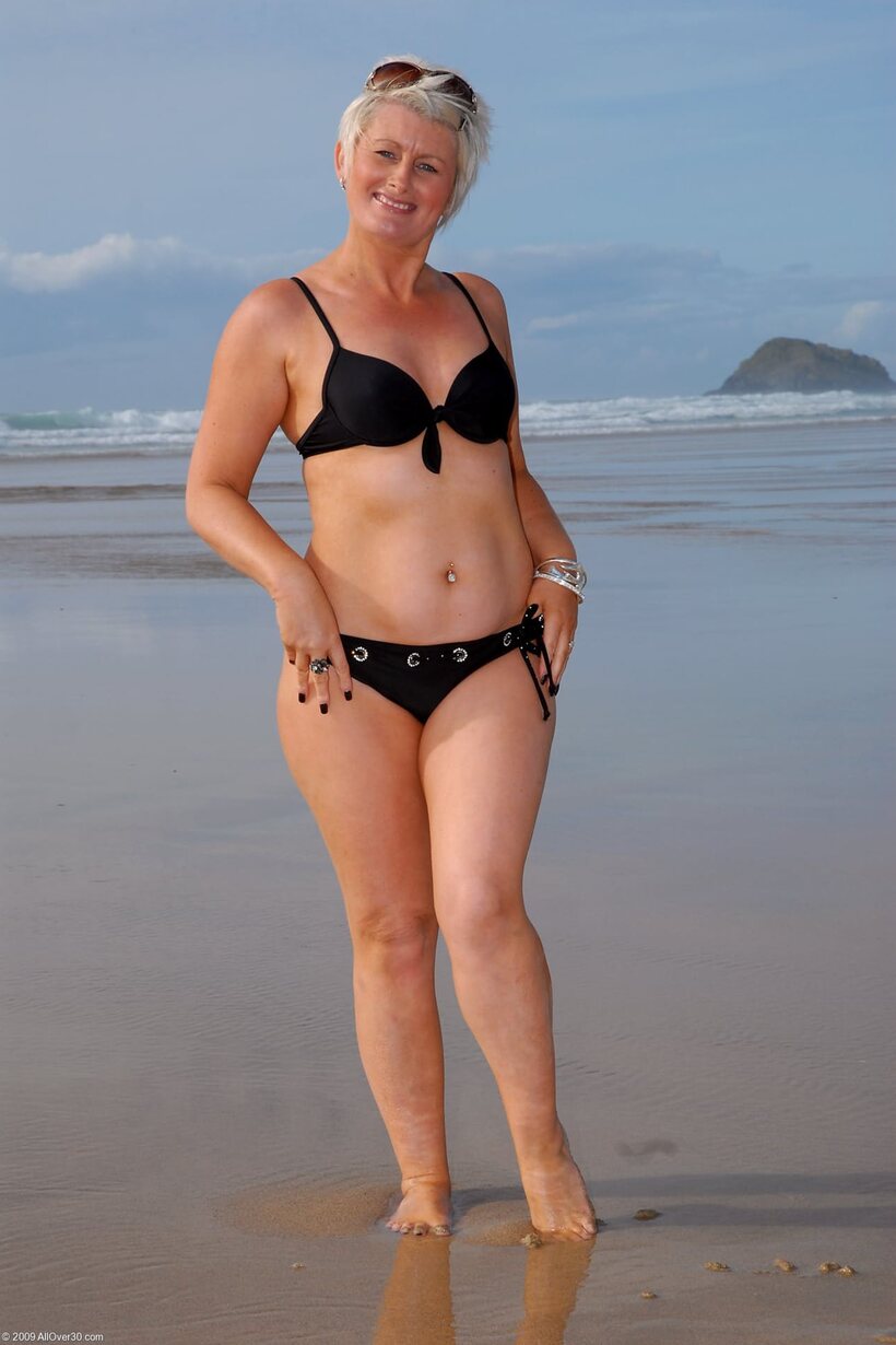 BBW nude photo 19 — Sally T shows her pierced pussy and tiny nipples in a beach dress