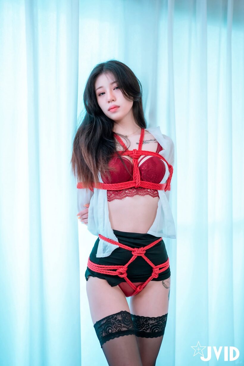 Asian nude photo 6 — Bound in rope, a Japanese beauty poses and bares her tits