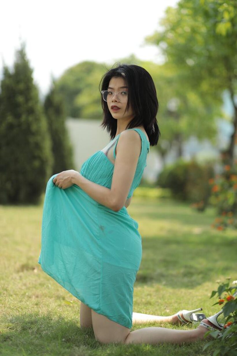 Asian nude photo 2 — Brunette girl strips out of her skirt and poses naked