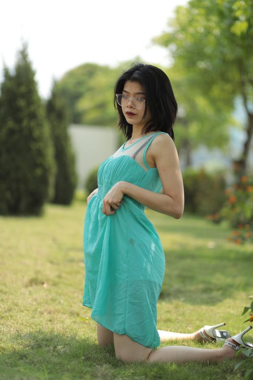 Image 11/21: Brunette girl strips out of her skirt and poses naked