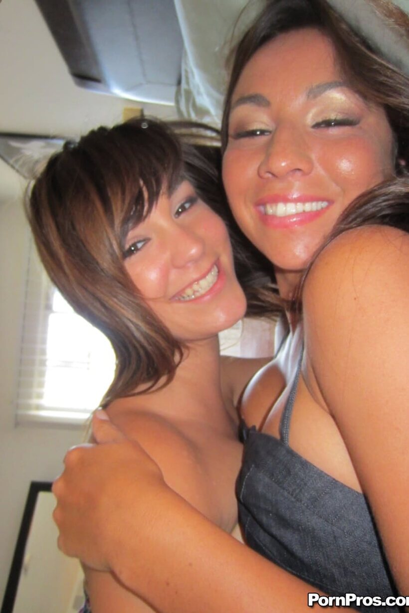 In bed, dark-haired beauties cuddle and kiss wearing shorts (shot 10)