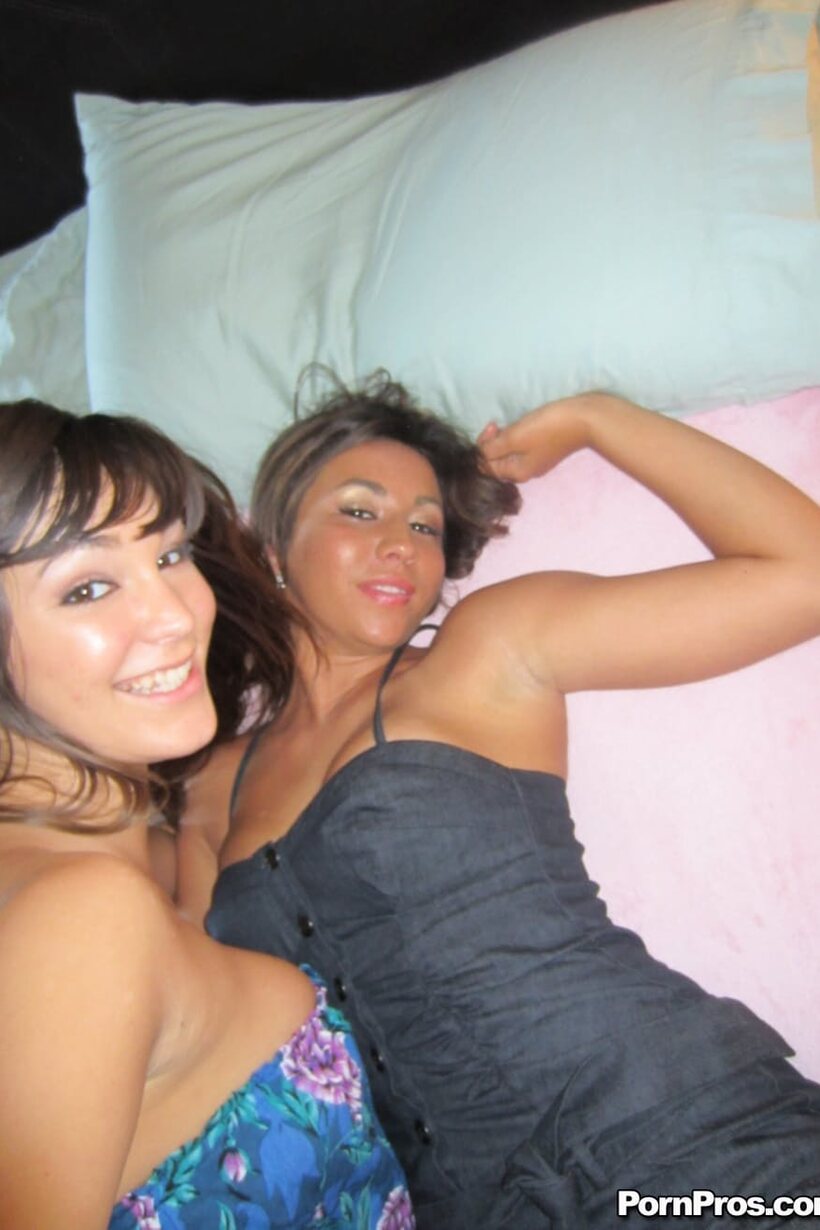 African nude photo 12 — In bed, dark-haired beauties cuddle and kiss wearing shorts