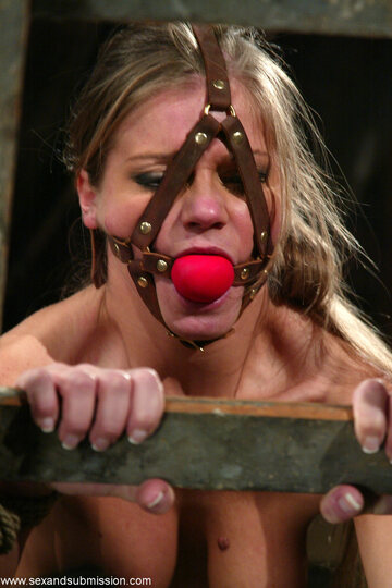 Bound and ball-gagged, Rita Faltoyano is fingered while tied up