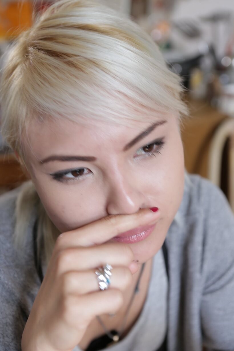 Photo 20 — Mai puts her clothes on after posing naked on the bed