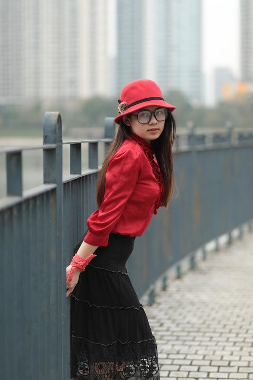 Natalia poses in a classy outfit on the bridge, Asian solo (shot 4)