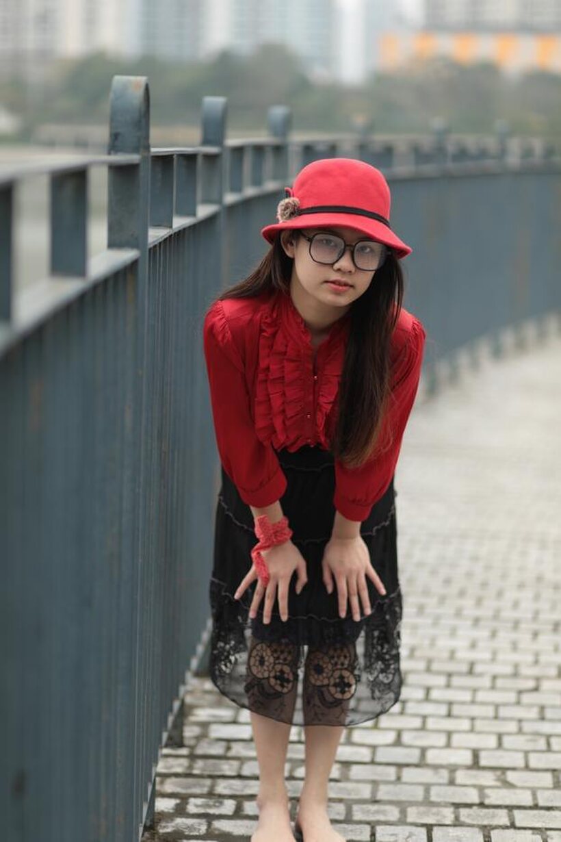 Image 8/21: Natalia poses in a classy outfit on the bridge, Asian solo