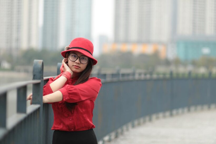 Natalia poses in a classy outfit on the bridge, Asian solo (shot 10)
