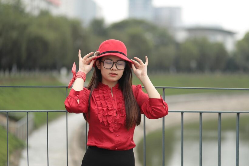 Image 16/21: Natalia poses in a classy outfit on the bridge, Asian solo